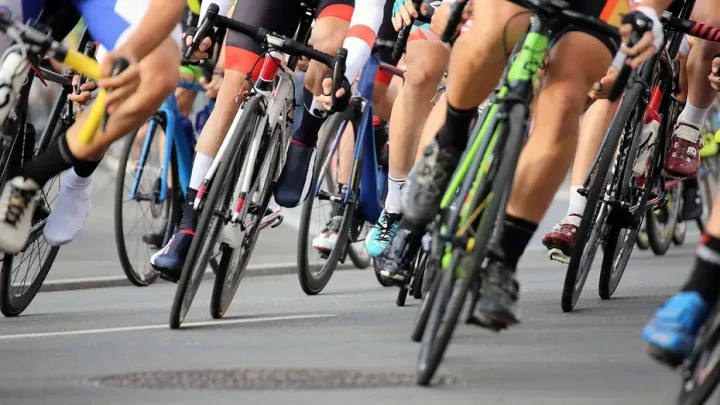 Elderly fan on a mobility scooter sends cyclists flying through the air after driving onto course mid-race