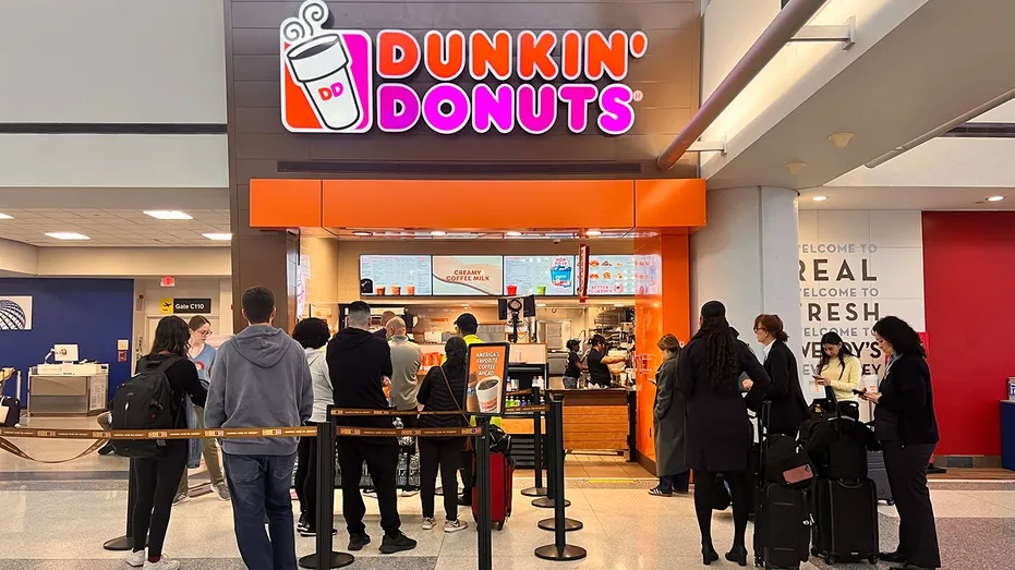 dunkin-donuts-customers-wait-in-line-at-airport