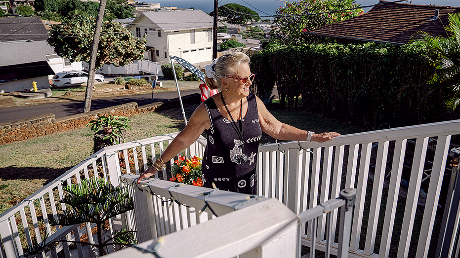sandra-may-outside-home