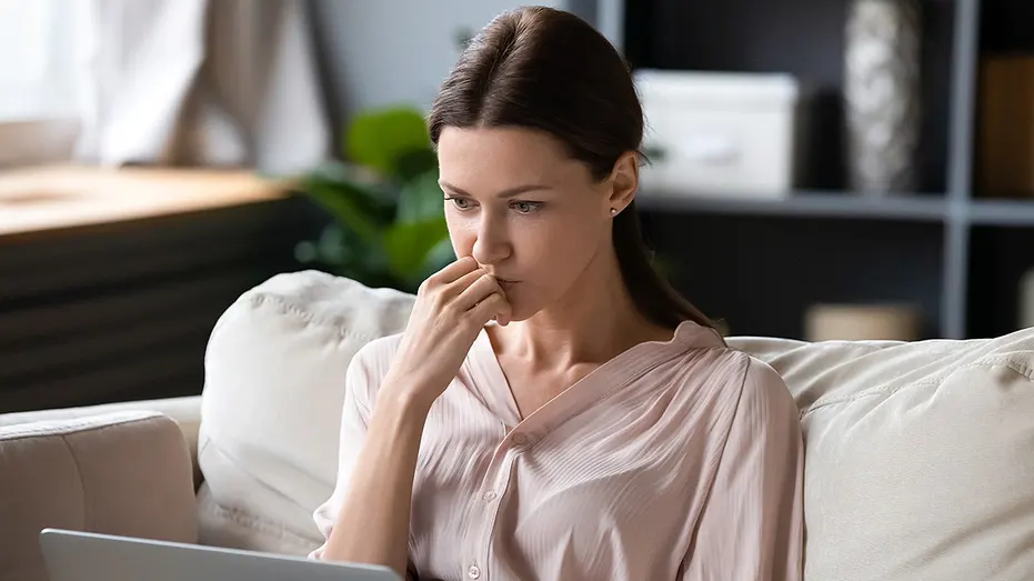 woman-working-laptop-sofa